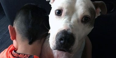 The Lowenstein's son and his dog, Mia
