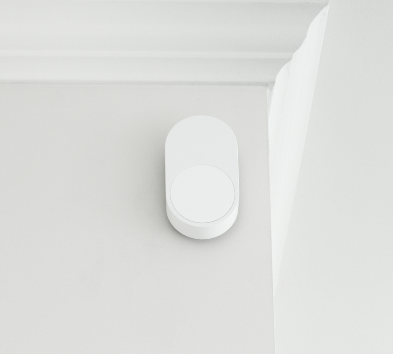 ADT Motion Sensor on a wall by a ceiling ADT Motion Sensor on a wall by a ceiling