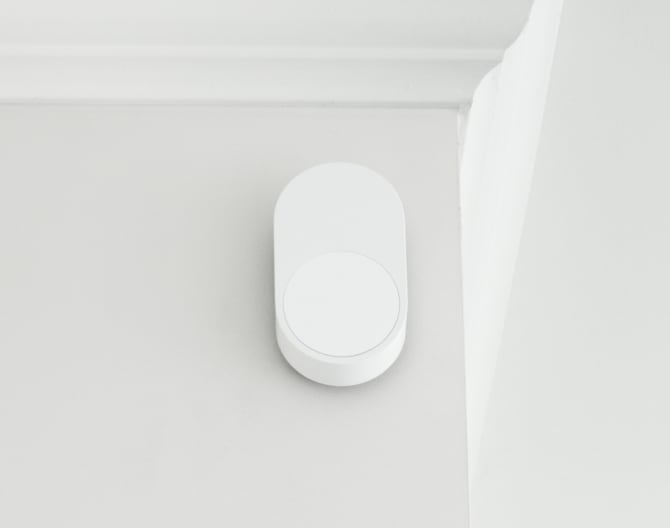 ADT Motion Sensor on a wall by a ceiling ADT Motion Sensor on a wall by a ceiling